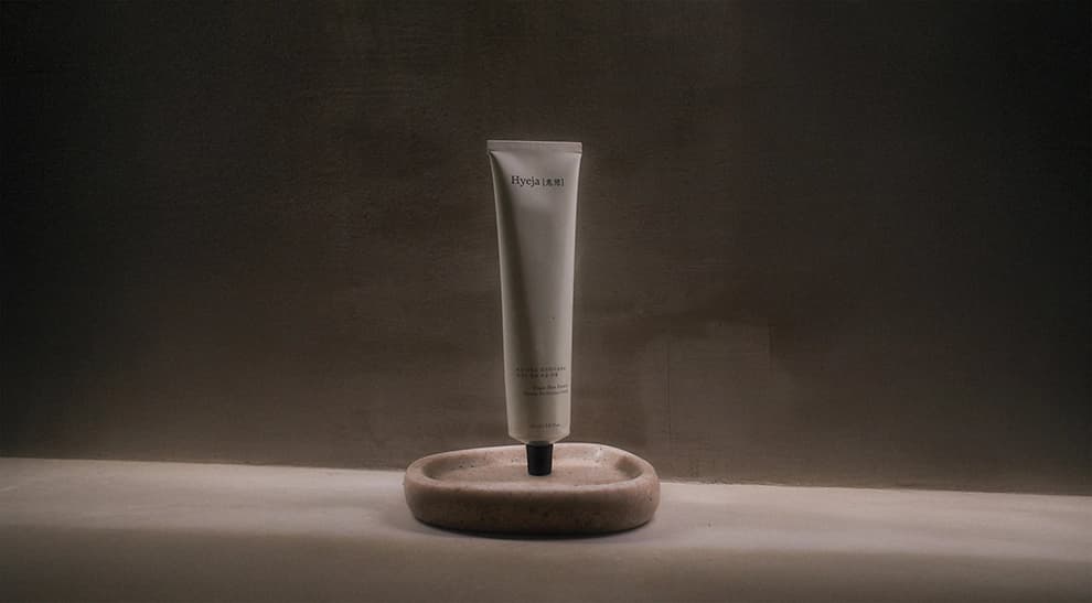 portrait of a hyeja tube product upright on a table